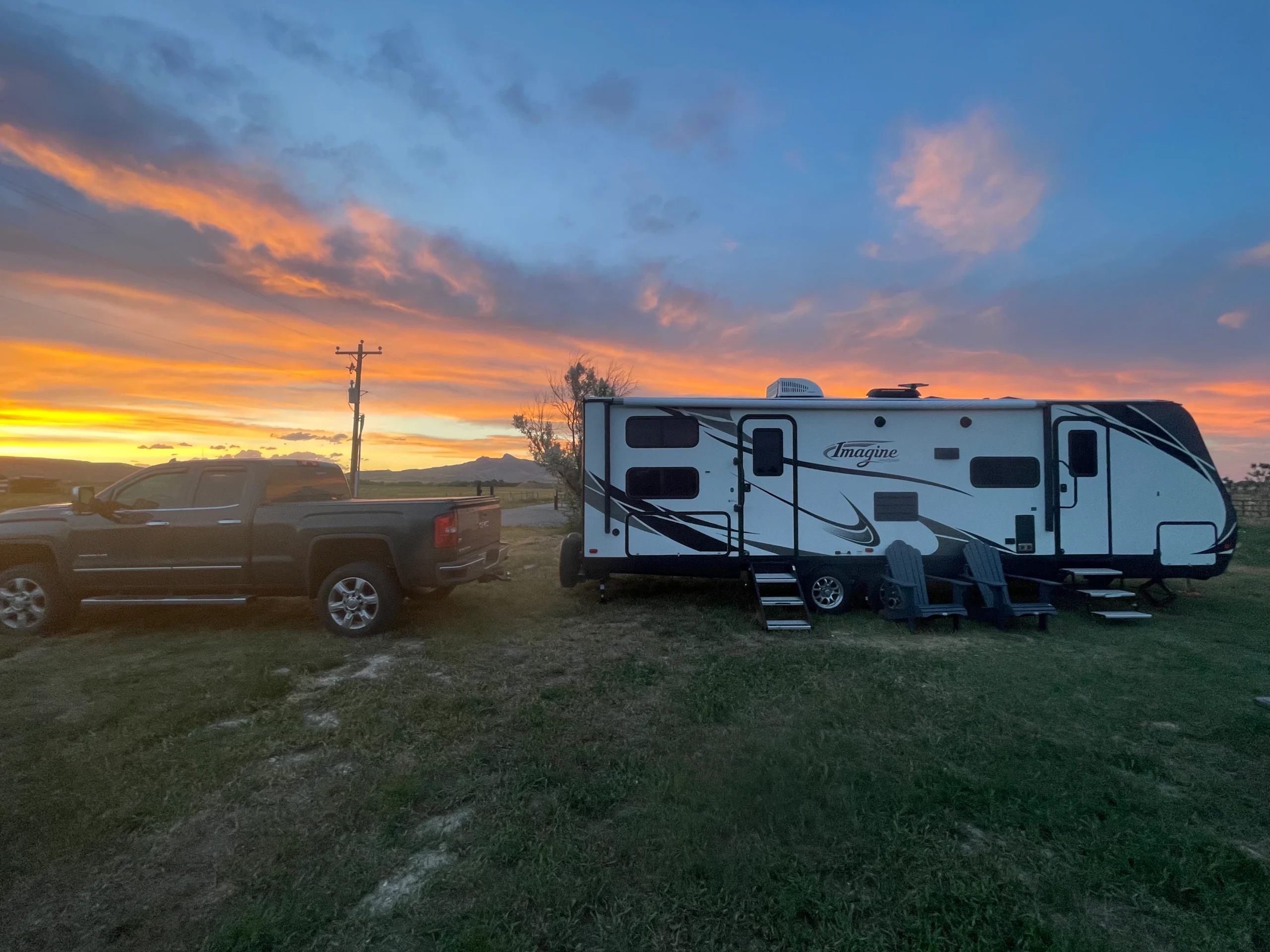 Luxury Class A motorhome driving on scenic highway through mountains, representing higher RV insurance costs for motorized and high-value rigs